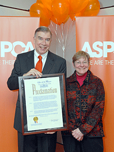 ASPCA President and CEO Edwin Sayres and Mayor's Alliance President Jane Hoffman display a proclamation from NYC Mayor Michael Bloomberg commemorating the launch of ASPCA® Mission: Orange™.