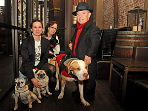 TAILS co-founder Larissa Whitney, Mayor's Alliance program director Jenny Coffey, and Animal Planet's Pit Boss Shorty Rossi were on hand at the 'Family Portraits' fundraiser at ViNO ViNO. Larissa's Pugs, Moby and Tuna (a Picasso Veterinary Fund recipient she adopted), Oliver, and Shorty's rescue Pit, Hercules, joined the festivities. (Photo by Marie Havens)