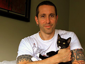 Expert feral cat tamer Joe Martini and his partner Jaime Gross are fostering and socializing formerly feral kitten Clover and his brother Lucky. (Photo by Jaime Gross)