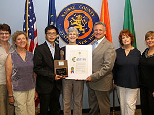 On August 10, HSVMA award-winner Dr. Laura Gay Senk (center) accepted her certificate and plaque from (left to right) Barbara Levine, Veterinary Assistant; Lynne Carson, Licensed Veterinary Technician; Patrick Kwan, HSUS New York State Director; Edward Mangano, Nassau County Executive; Joan Phillips, President, Animal Lovers League; and Jeanne Tiedemann, RN and Veterinary Assistant. (Photo by Animal Lovers League)