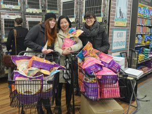 Certified TNR Caretakers and rescue group representatives picked up the bags of Halo Spot's Stew so generiously shared by KittyKind. (Photo by KittyKind)