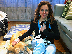 April Lang, LCSW, shown here with her dog Ruby and cat Hawkins, offers animal bereavement counseling and other therapy services. (Photo by Neil Sirni)