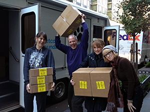 Mayor's Alliance for NYC's Animals staff members Maggie, Steve, Connie, and Diane load cases of food generously donated by Stella & Chewy's to distribute to pet owners in storm-damaged areas to help them continue to care for their animals. The Alliance adoption van temporarily joined our Wheels of Hope fleet to move animals and supplies during this crisis.